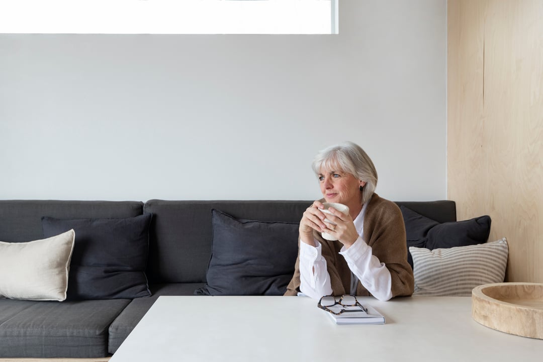 Women enjoying a cup of coffee in her ADU 