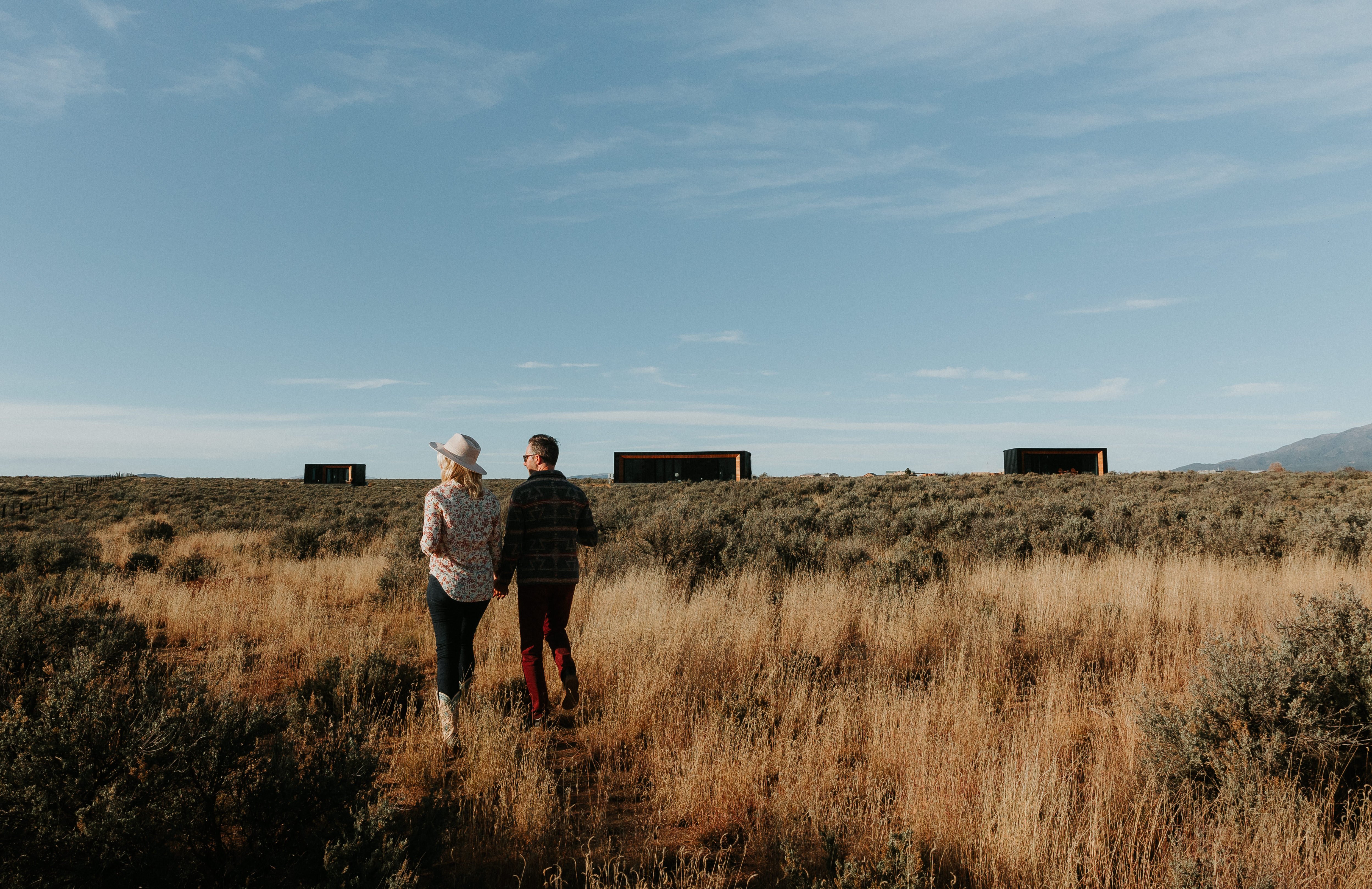 Couple admiring Modal modular units in the high desert of new mexico