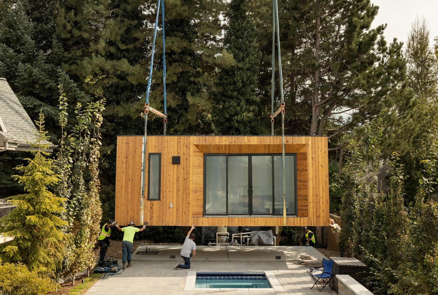 Modal ADU being craned onto a foundation on a Californian property