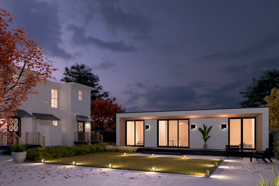 Modal's modern white accessory dwelling unit in a sleek backyard in the evening.